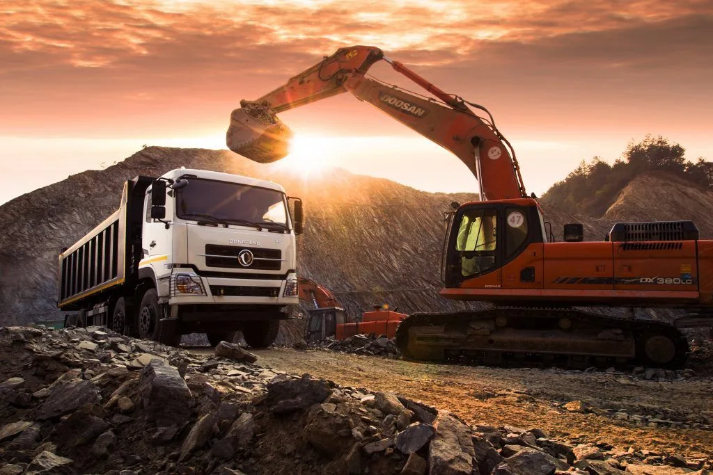 Excavator and dump truck